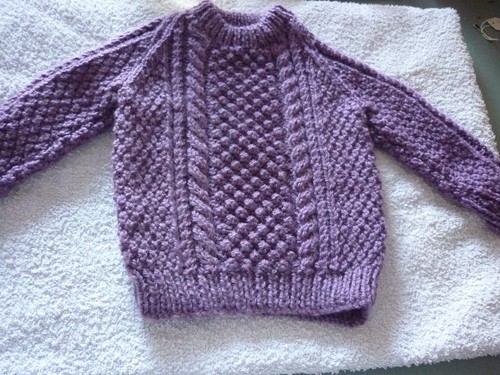 Hand knitted baby - hand,