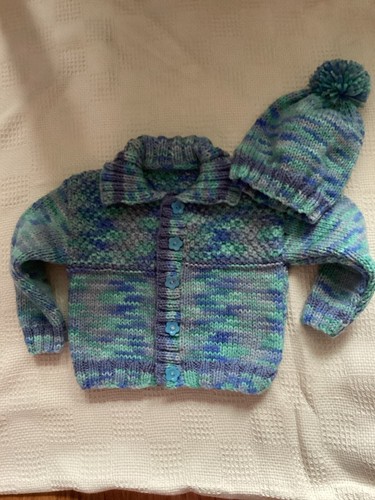 Handknitted baby cardigan and
